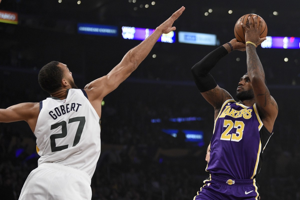Rudy Gobert (27) contests LeBron James (23) shot 